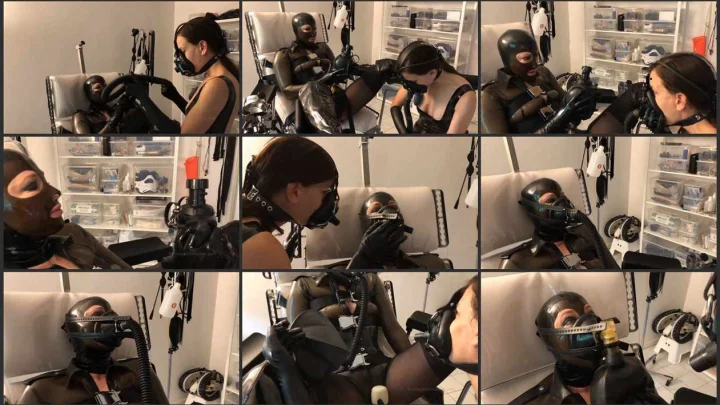 Screenshot 1 aus Lezdom Rubber Bondage, Horny Rubber Breath Play with Elise Graves and Anna Rose