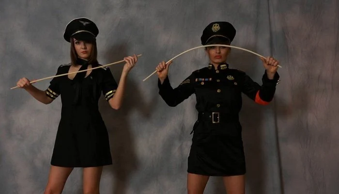 Video abspielen: Double FemDom POV in Uniform, We Will Cane You Black and Blue with Lady Olga and Lady Kat