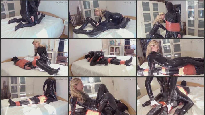 Screenshot 1 aus Wrapped in Latex Tape Bondage with Mistress Larissa