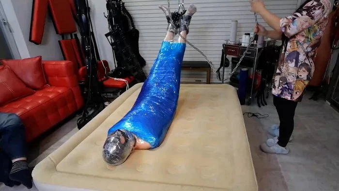 Upside Suspension in Tight Mummification with vibrator on the dick